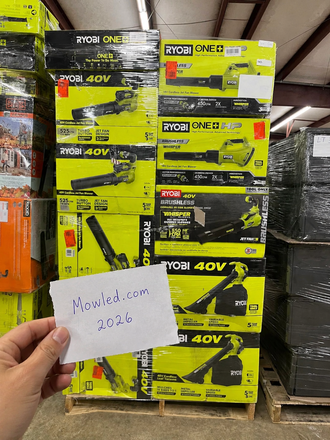Cordless blowers and outdoor tools stocked on warehouse shelving